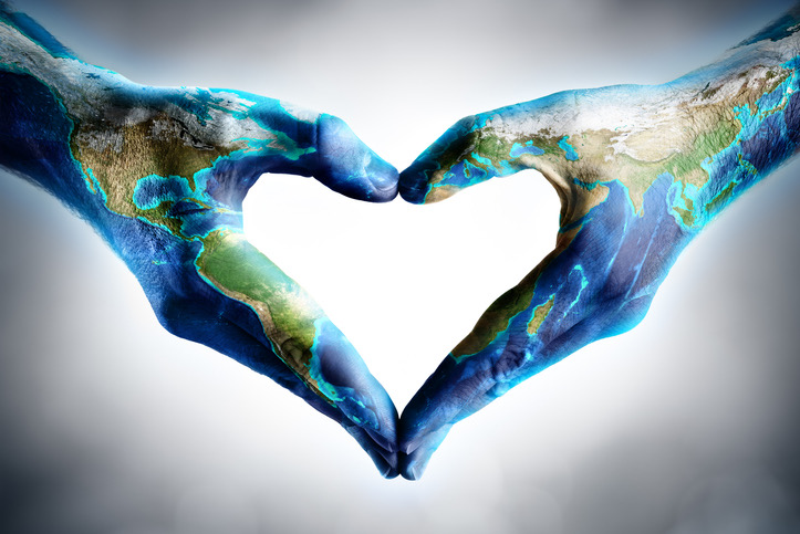 Hands forming a heart shape, representing global connection and care